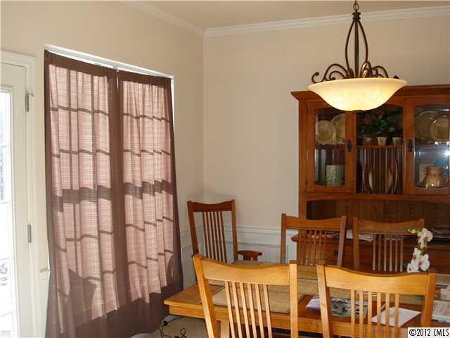 566 6th Baxter Crossing Fort Mill, SC 29708 - Photo 4 of 7 a dining room with furniture and a chandelier