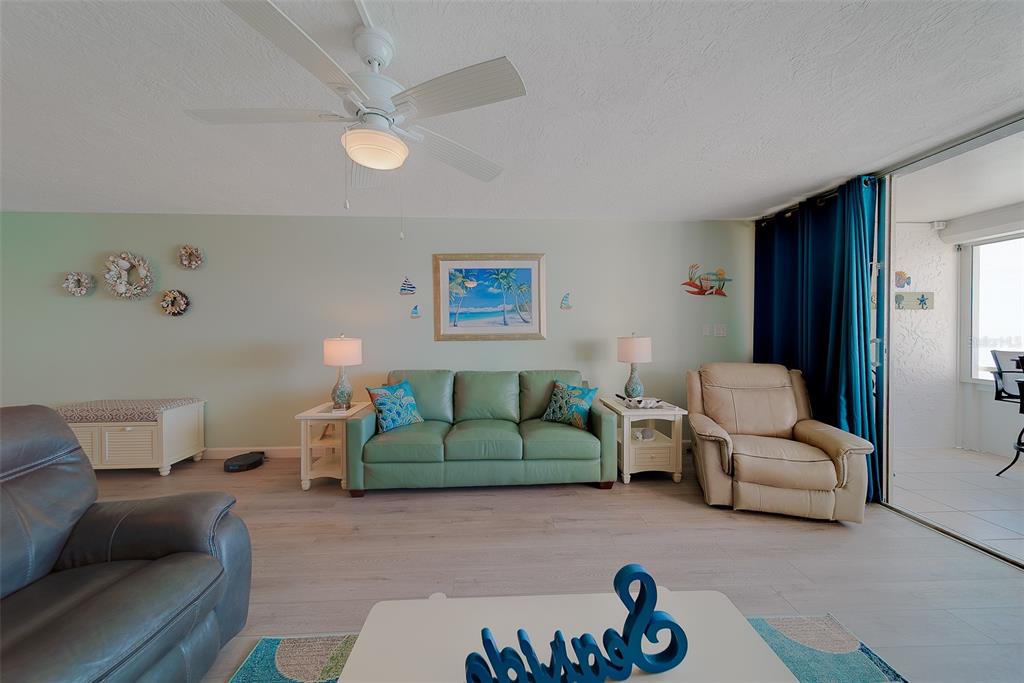 17920 Gulf Boulevard, Unit 1205 Redington Shores, FL 33708 - Photo 15 of 67 a living room with furniture and a couch