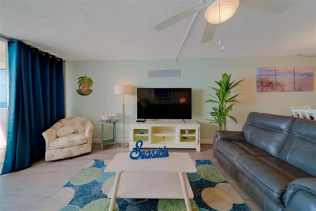 a view of a dining room with furniture and a window