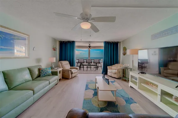 a view of a livingroom with furniture and a flat screen tv