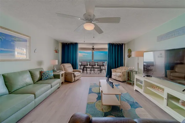 a view of a livingroom with furniture and a flat screen tv
