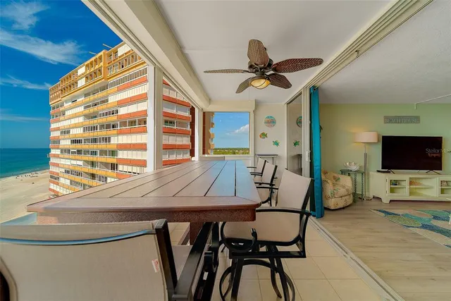 a bedroom with furniture and a large window