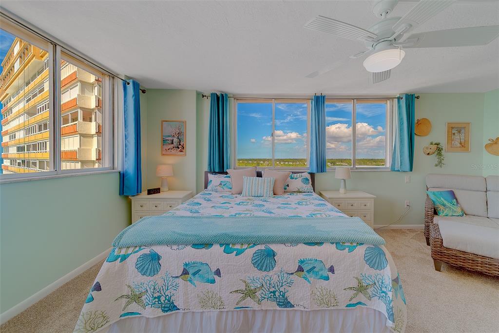 17920 Gulf Boulevard, Unit 1205 Redington Shores, FL 33708 - Photo 27 of 67 a bedroom with a bed and window