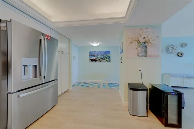a kitchen with stainless steel appliances granite countertop a refrigerator and a stove