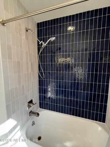 a bathroom with a sink toilet and mirror