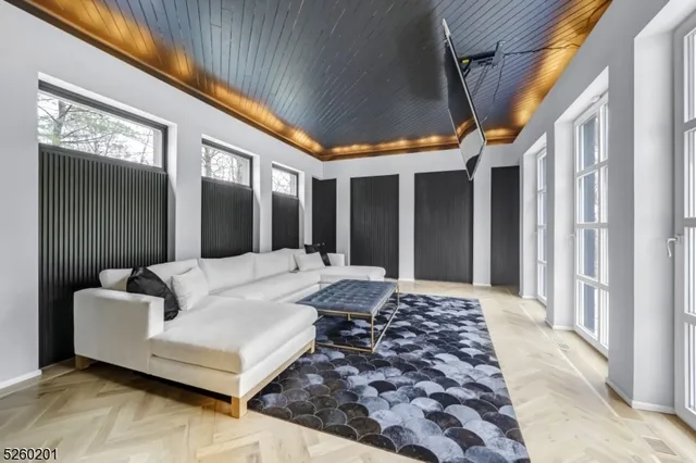 a view of a room with a large window and front door