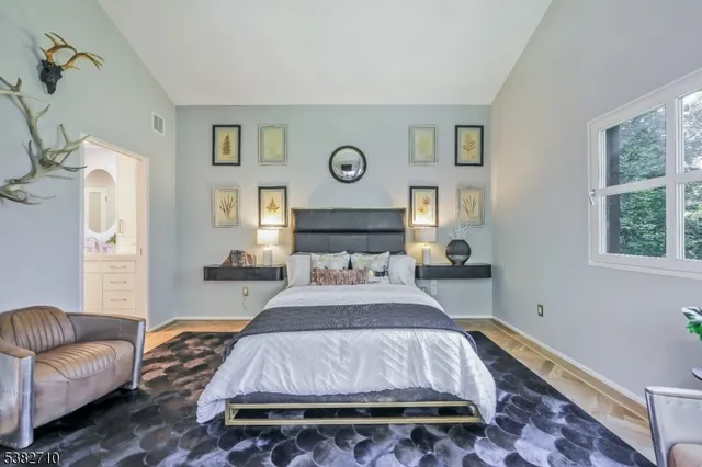 a spacious bathroom with a double vanity sink and a mirror