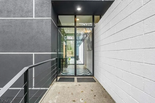 a bedroom with a bed and glass door