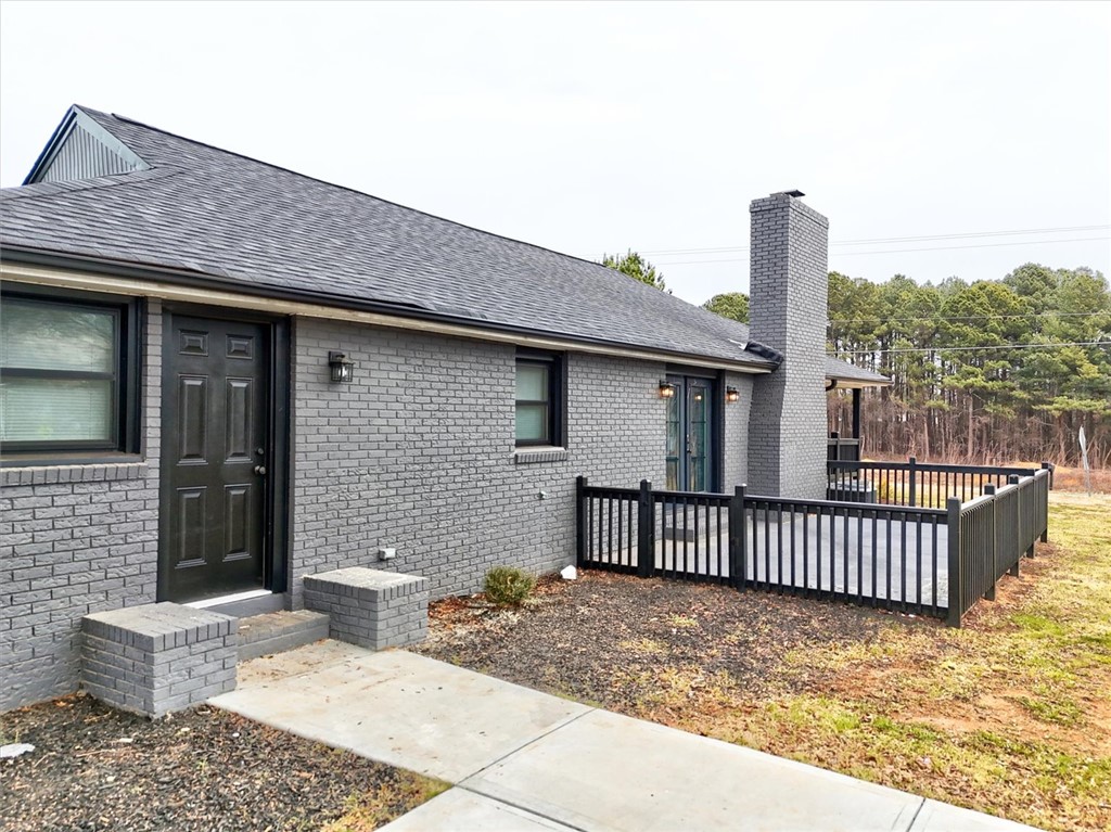 801 Cherokee Road Pelzer, SC 29669 - Photo 8 of 45 This charming home offers a spacious exterior, featuring a lovely patio and a well-maintained yard.