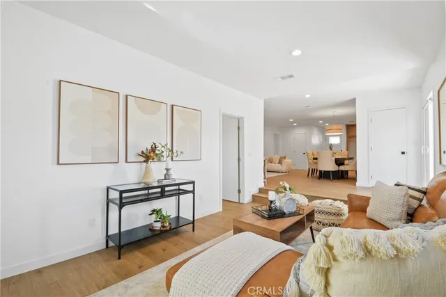 a workspace room with furniture and wooden floor