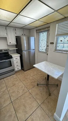 a view of a kitchen with electric appliances