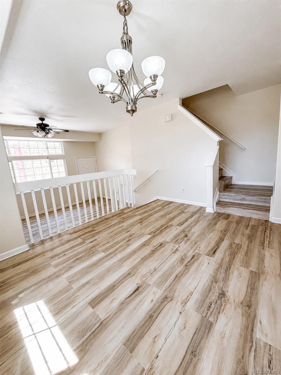 8199 Welby Road, Unit 4301 Denver, CO 80229 - Photo 5 of 19 a view of a bedroom with wooden floor