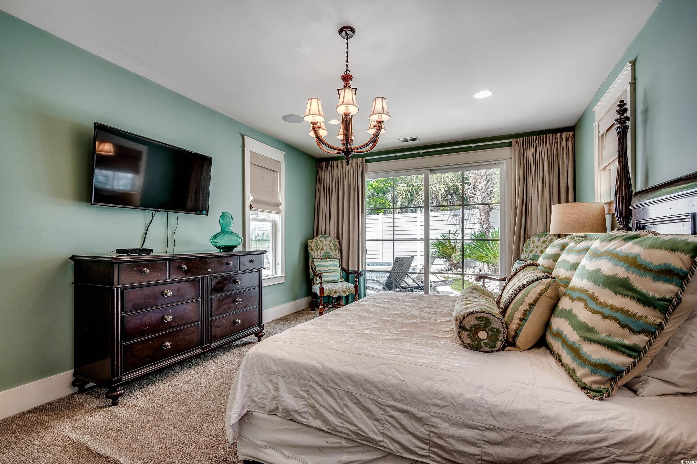 4964 Salt Creek Court North Myrtle Beach, SC 29582 - Photo 11 of 35 Carpeted bedroom featuring a chandelier, visible vents, baseboards, and multiple windows