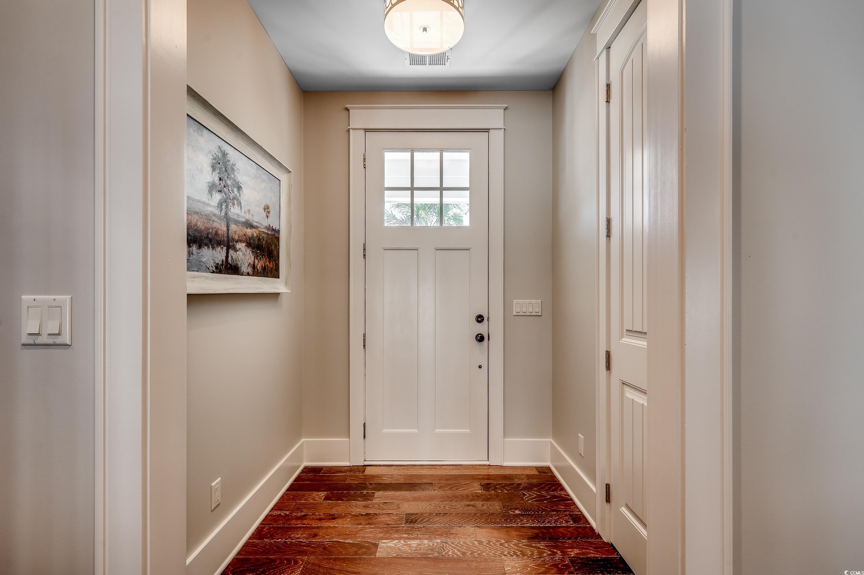 4964 Salt Creek Court North Myrtle Beach, SC 29582 - Photo 16 of 35 Doorway to outside with visible vents, baseboards, and dark wood finished floors