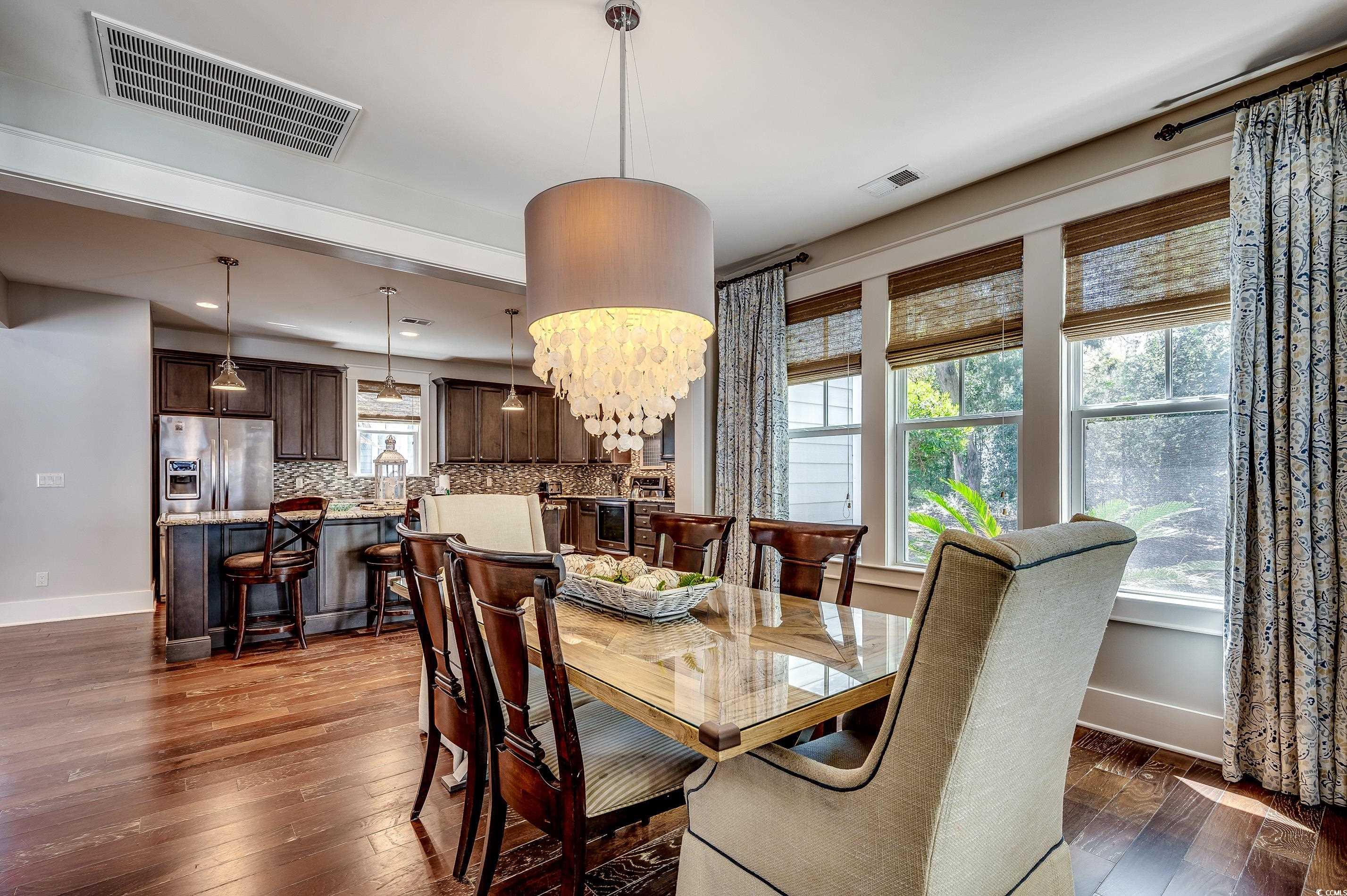 4964 Salt Creek Court North Myrtle Beach, SC 29582 - Photo 26 of 35 Dining room with visible vents, baseboards, and dark wood-style floors