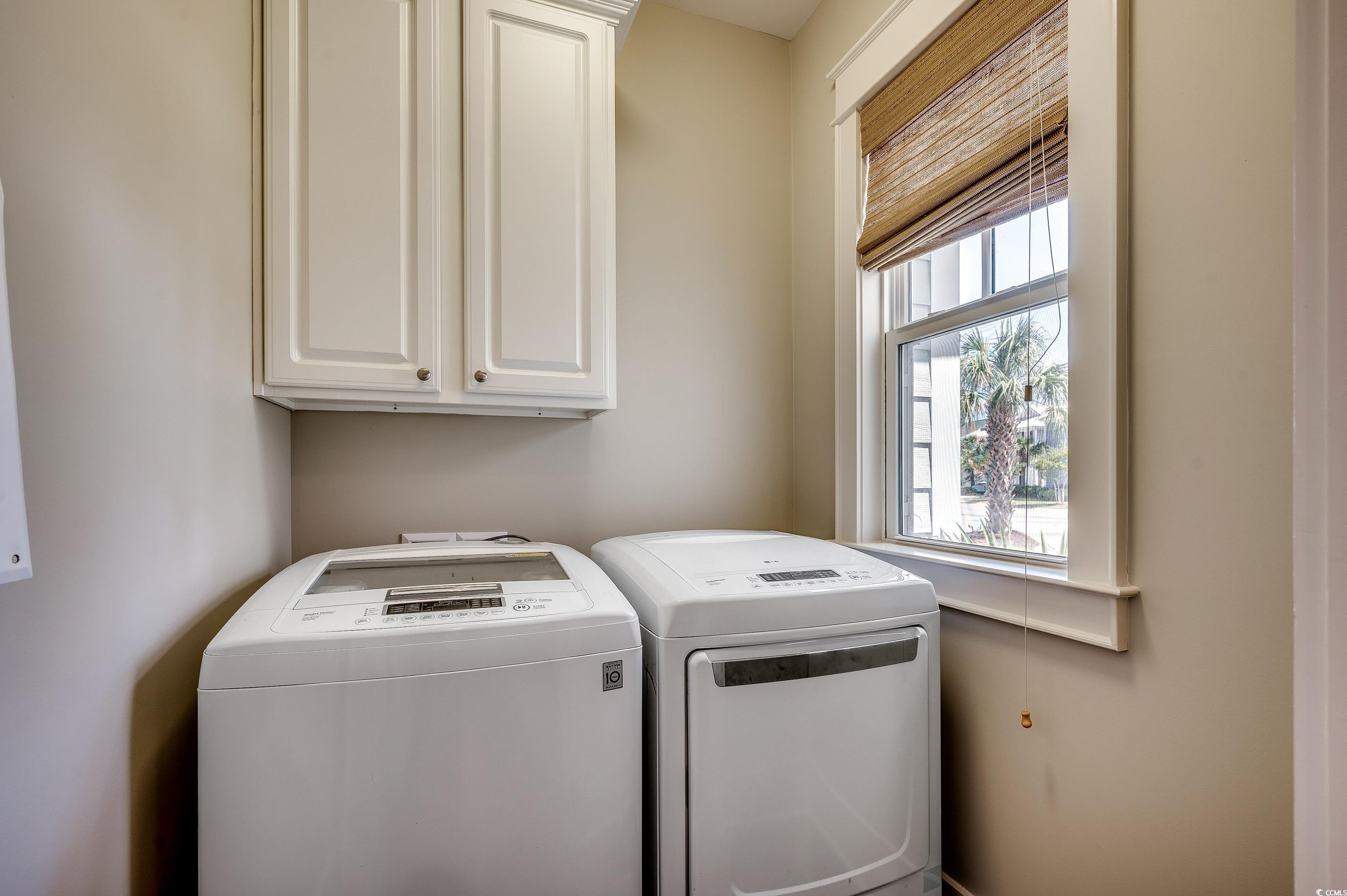 4964 Salt Creek Court North Myrtle Beach, SC 29582 - Photo 29 of 35 Clothes washing area with washing machine and dryer and cabinet space