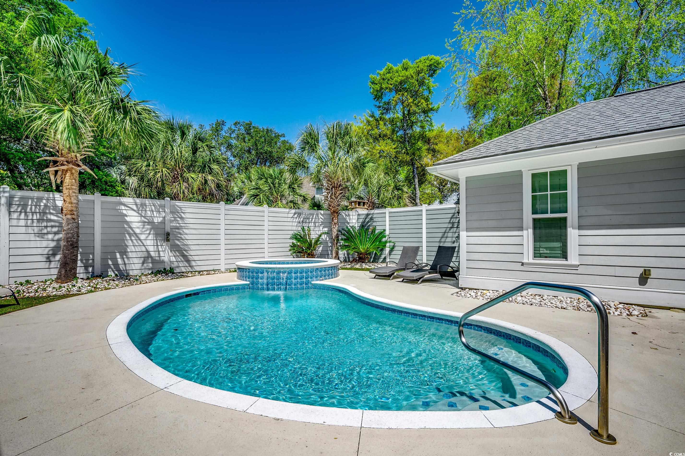 4964 Salt Creek Court North Myrtle Beach, SC 29582 - Photo 31 of 35 View of swimming pool with a fenced backyard, a patio area, and a pool with connected hot tub