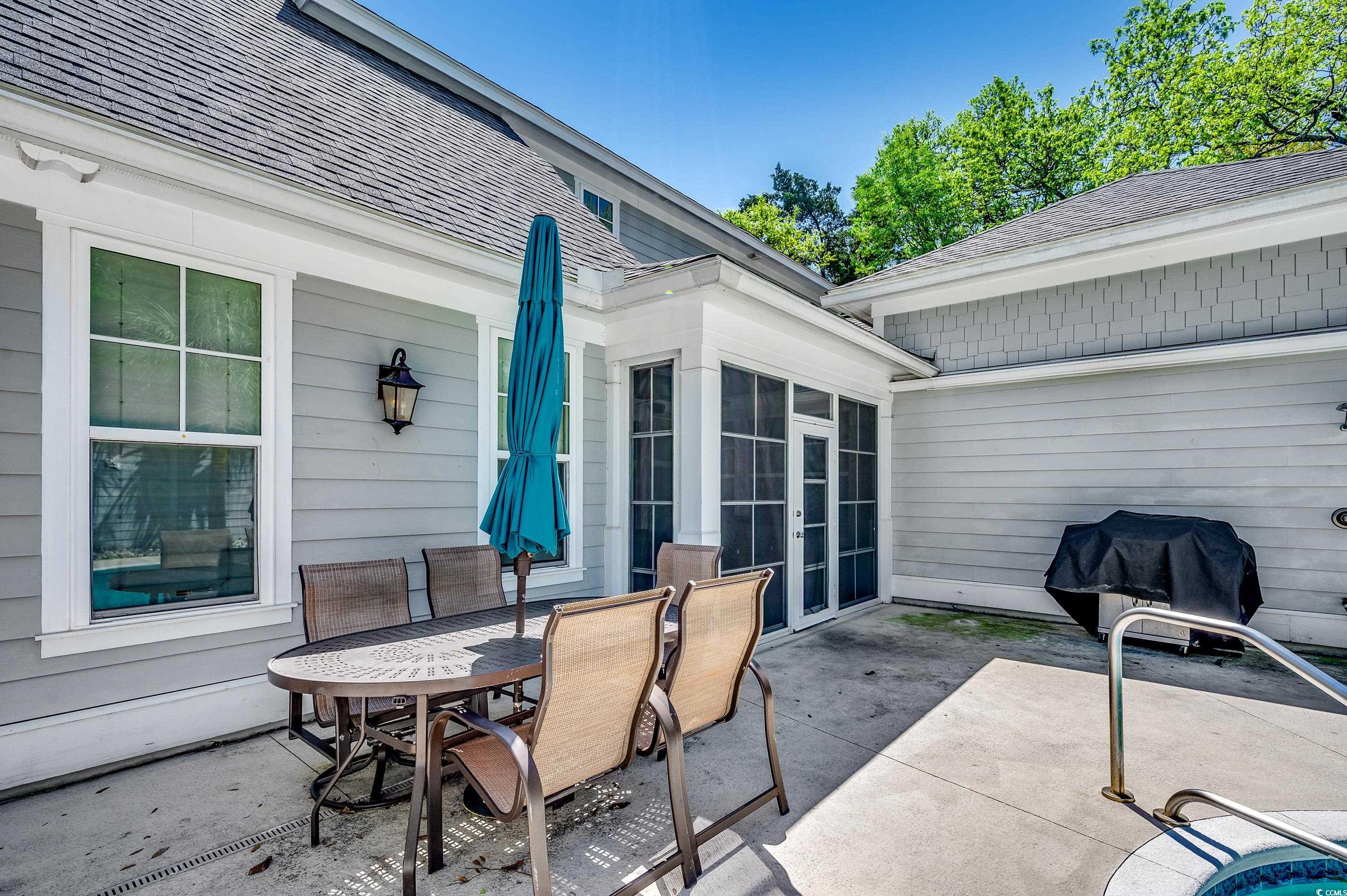 4964 Salt Creek Court North Myrtle Beach, SC 29582 - Photo 34 of 35 View of patio featuring grilling area and outdoor dining area