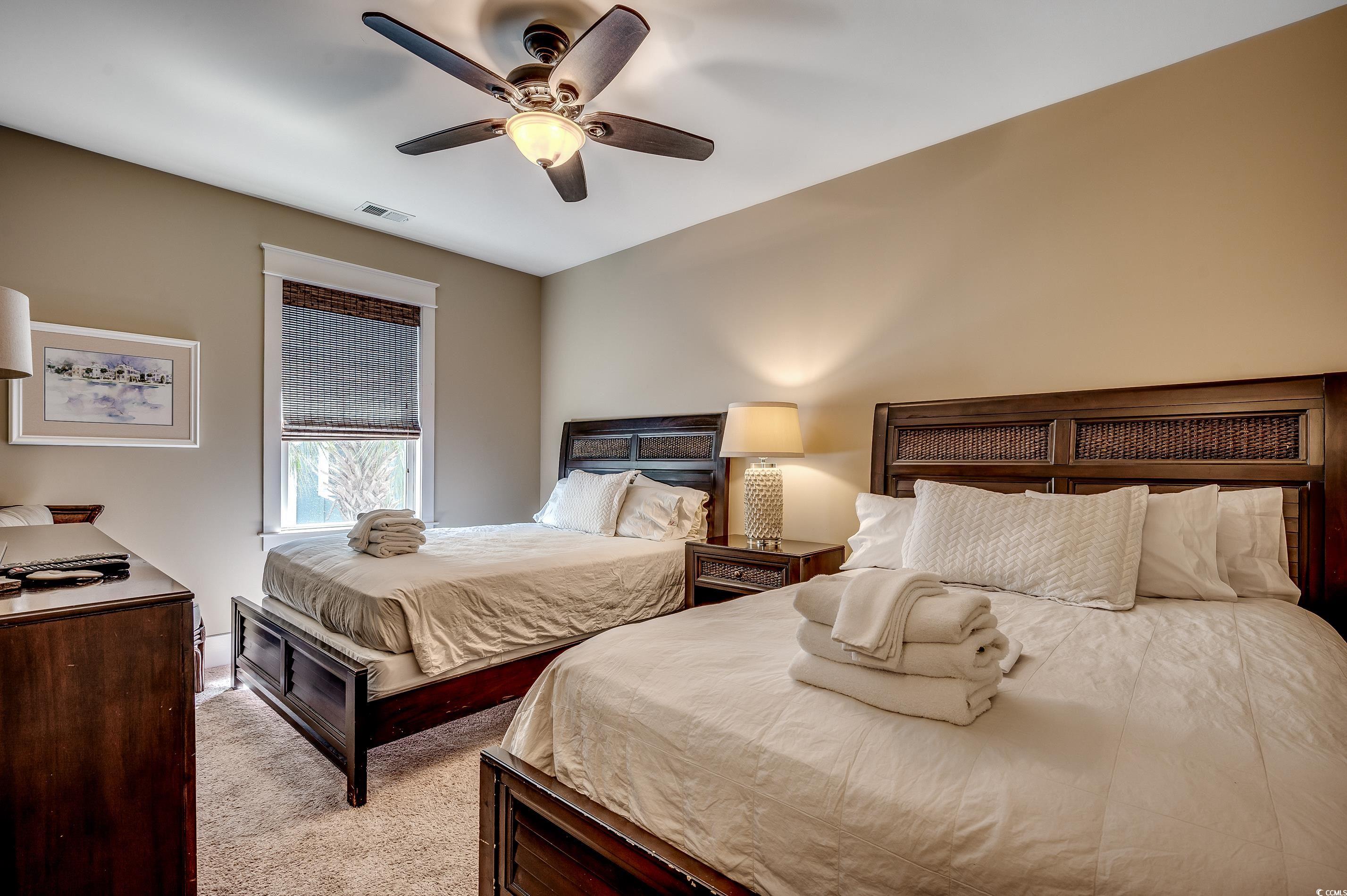 4964 Salt Creek Court North Myrtle Beach, SC 29582 - Photo 6 of 35 Carpeted bedroom with visible vents and ceiling fan