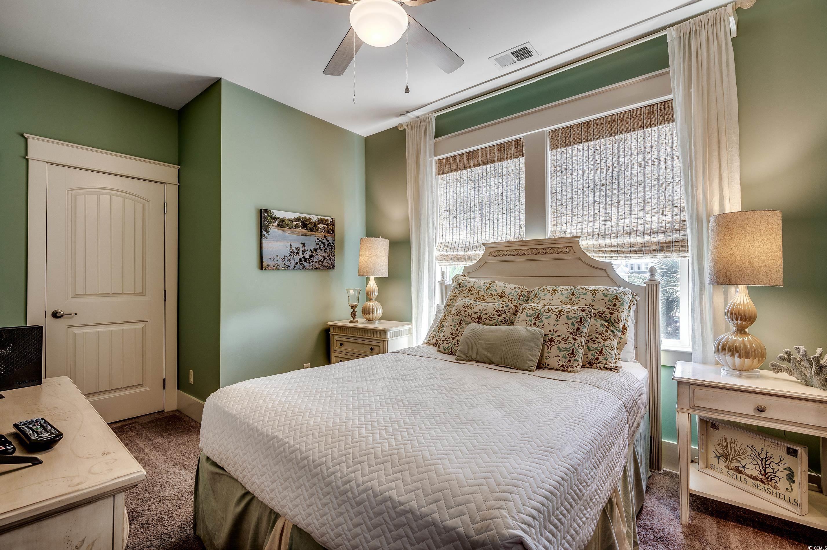 4964 Salt Creek Court North Myrtle Beach, SC 29582 - Photo 9 of 35 Bedroom featuring carpet, visible vents, a ceiling fan, and baseboards