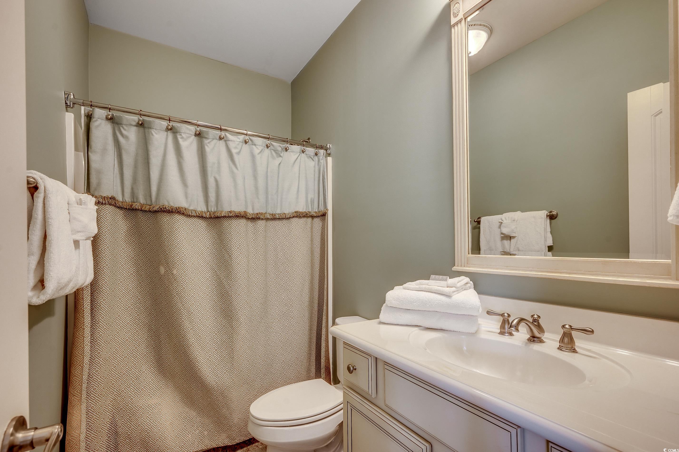 4964 Salt Creek Court North Myrtle Beach, SC 29582 - Photo 10 of 35 Full bath with toilet, a shower with curtain, and vanity