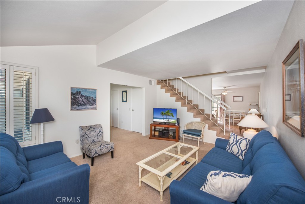 6087 Montecito Circle, Unit 4 Palm Springs, CA 92264 - Photo 2 of 45 a living room with furniture and wooden floor