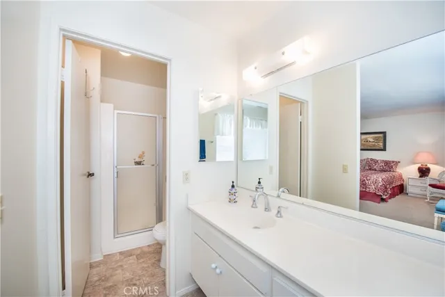 a en suite bathroom with a double vanity sink mirror and double