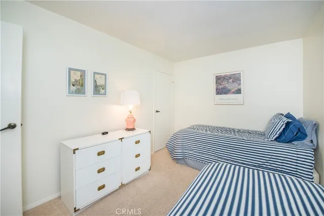 a bedroom with a bed and a cabinets