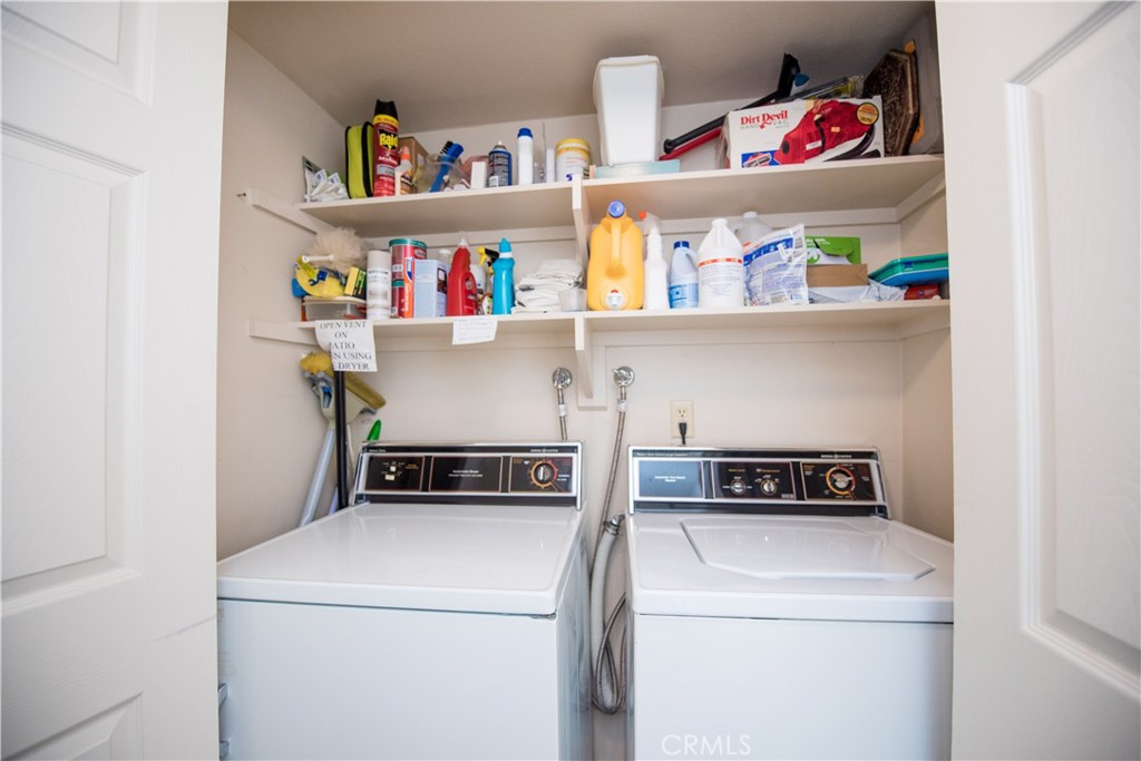 6087 Montecito Circle, Unit 4 Palm Springs, CA 92264 - Photo 28 of 45 a utility room with dryer and washer