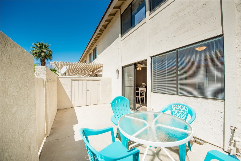 6087 Montecito Circle, Unit 4 Palm Springs, CA 92264 - Photo 32 of 45 a outdoor dining space with furniture