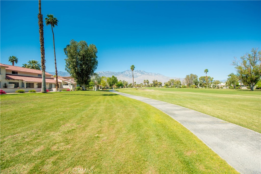6087 Montecito Circle, Unit 4 Palm Springs, CA 92264 - Photo 36 of 45 a view of a swimming pool and an outdoor space