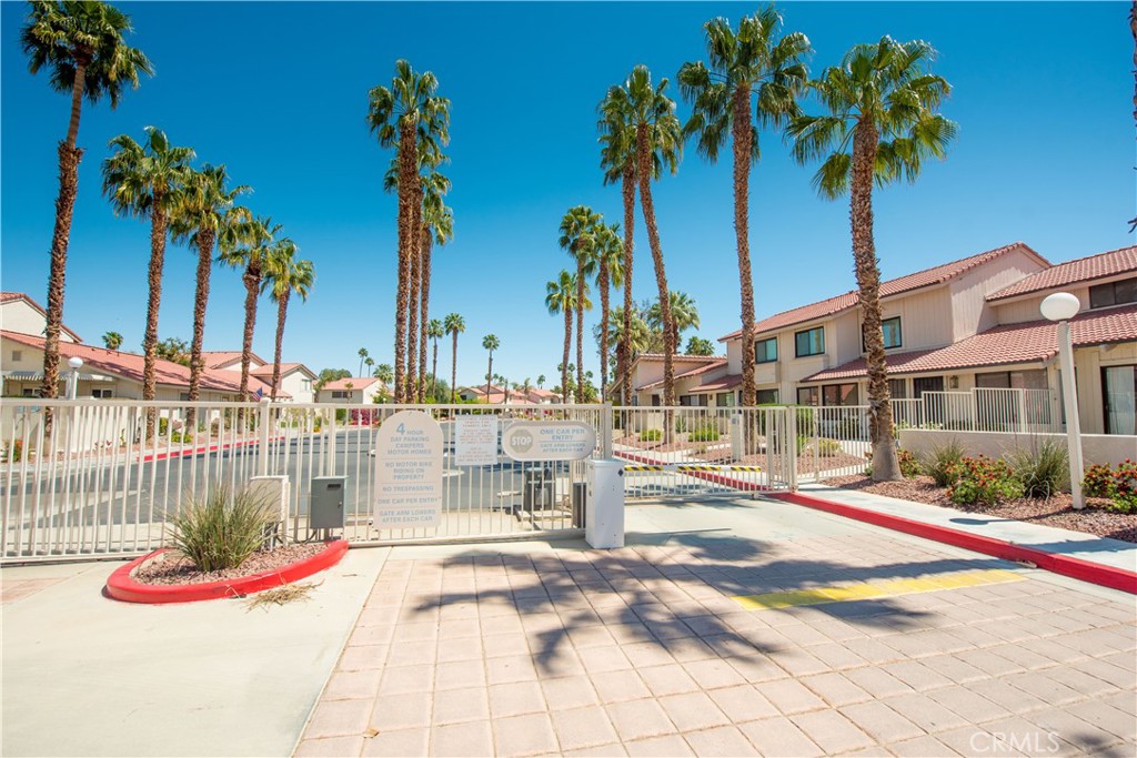 6087 Montecito Circle, Unit 4 Palm Springs, CA 92264 - Photo 40 of 45 a view of street with palm trees