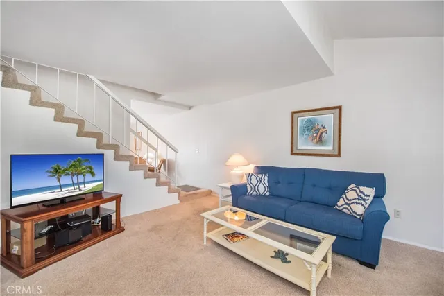 a living room with furniture and a lamp
