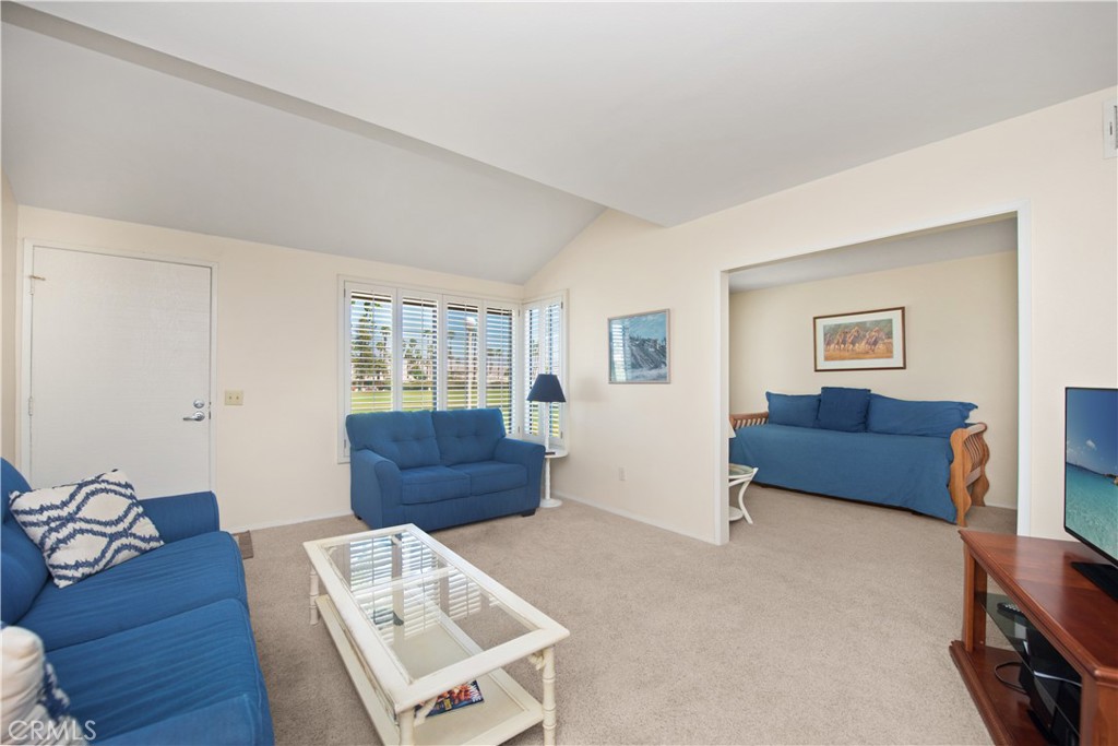 6087 Montecito Circle, Unit 4 Palm Springs, CA 92264 - Photo 5 of 45 a living room with furniture and wooden floor