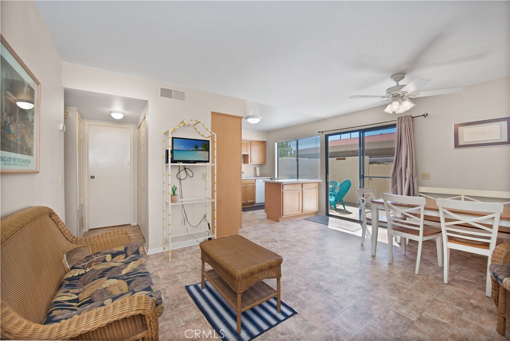 6087 Montecito Circle, Unit 4 Palm Springs, CA 92264 - Photo 9 of 45 a living room with furniture and a table