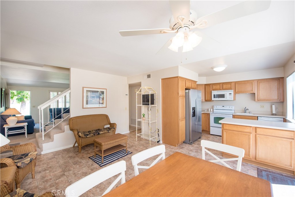 6087 Montecito Circle, Unit 4 Palm Springs, CA 92264 - Photo 10 of 45 a living room with furniture and a large window