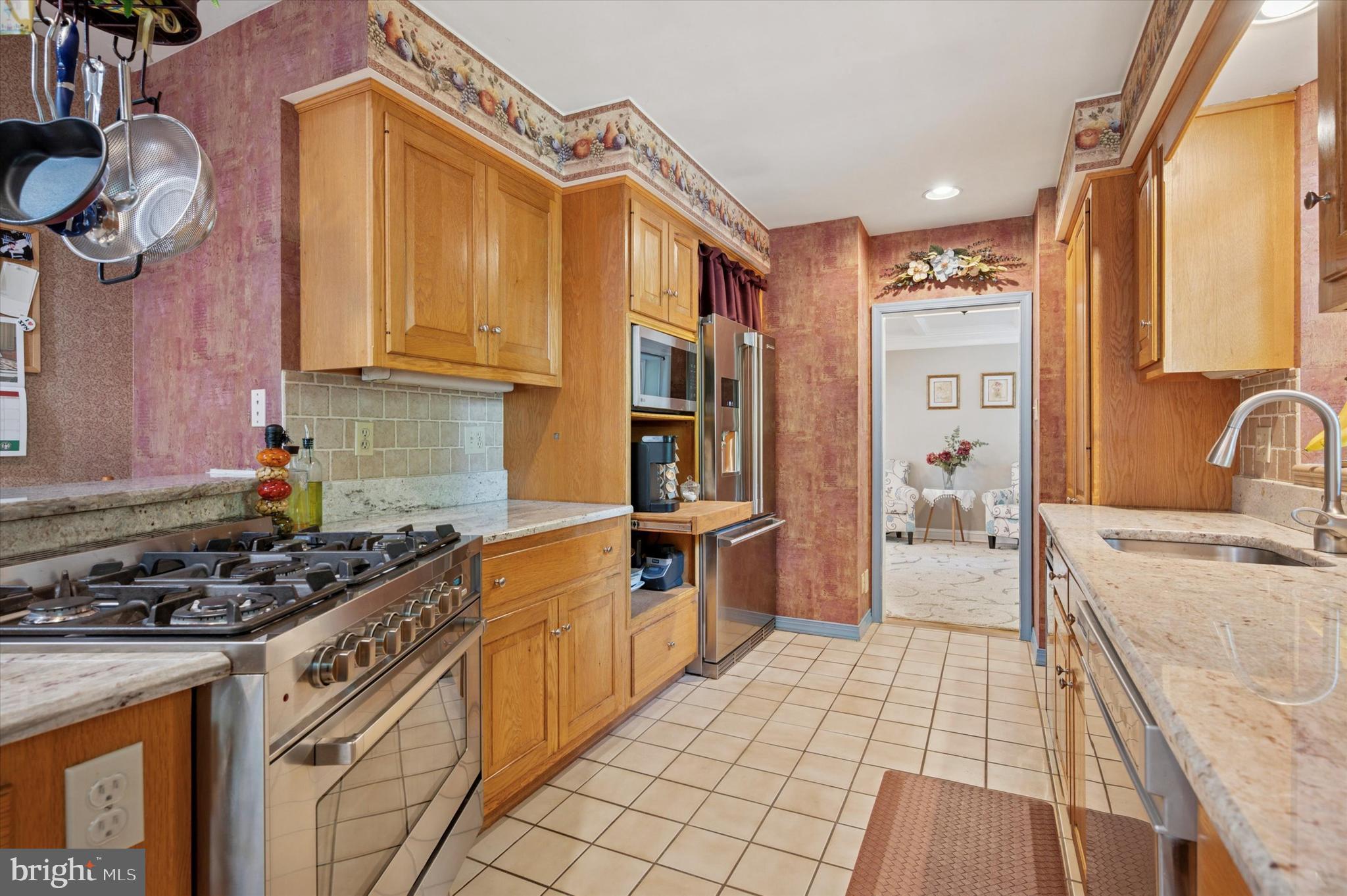 2440 Walton Road Huntingdon Valley, PA 19006 - Photo 12 of 47 a kitchen with stainless steel appliances granite countertop a stove a sink and a refrigerator