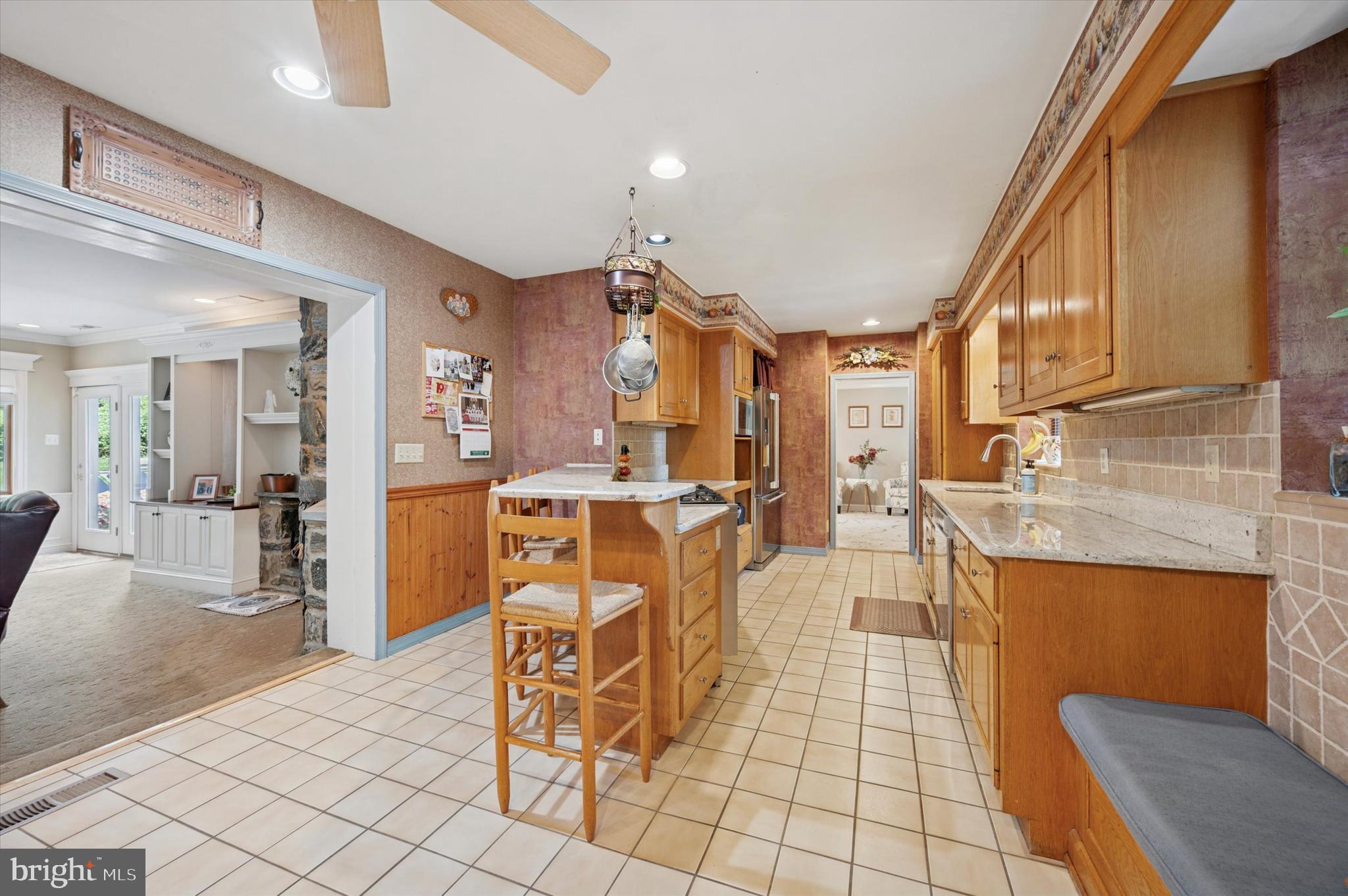 2440 Walton Road Huntingdon Valley, PA 19006 - Photo 13 of 47 a dining hall with stainless steel appliances kitchen island granite countertop a table and chairs
