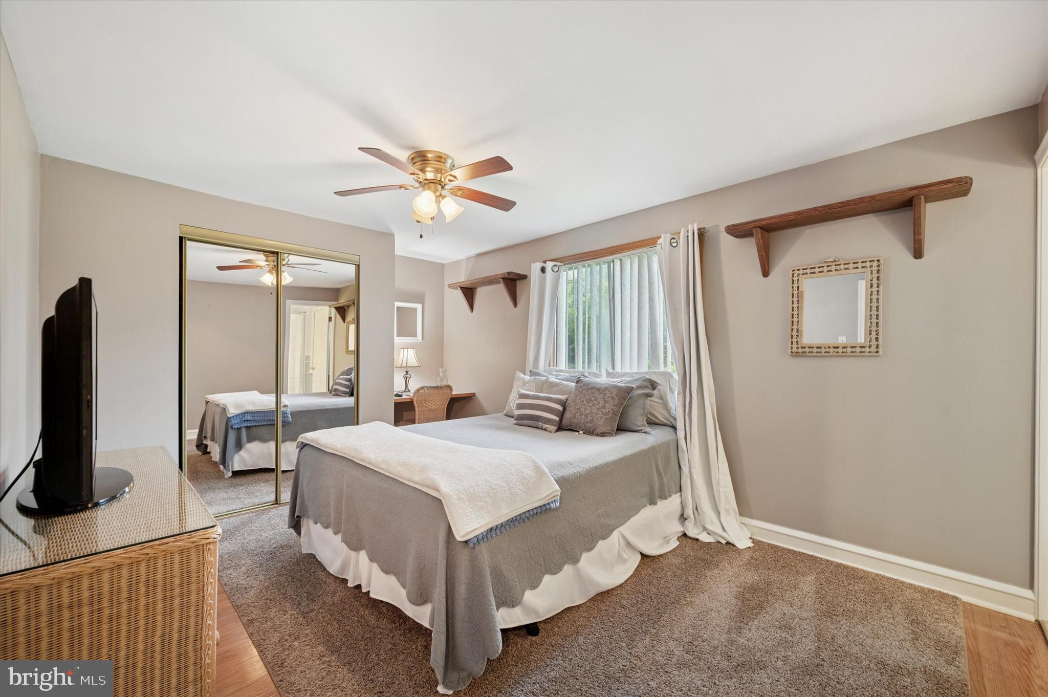 2440 Walton Road Huntingdon Valley, PA 19006 - Photo 20 of 47 a bedroom with a bed and a chandelier