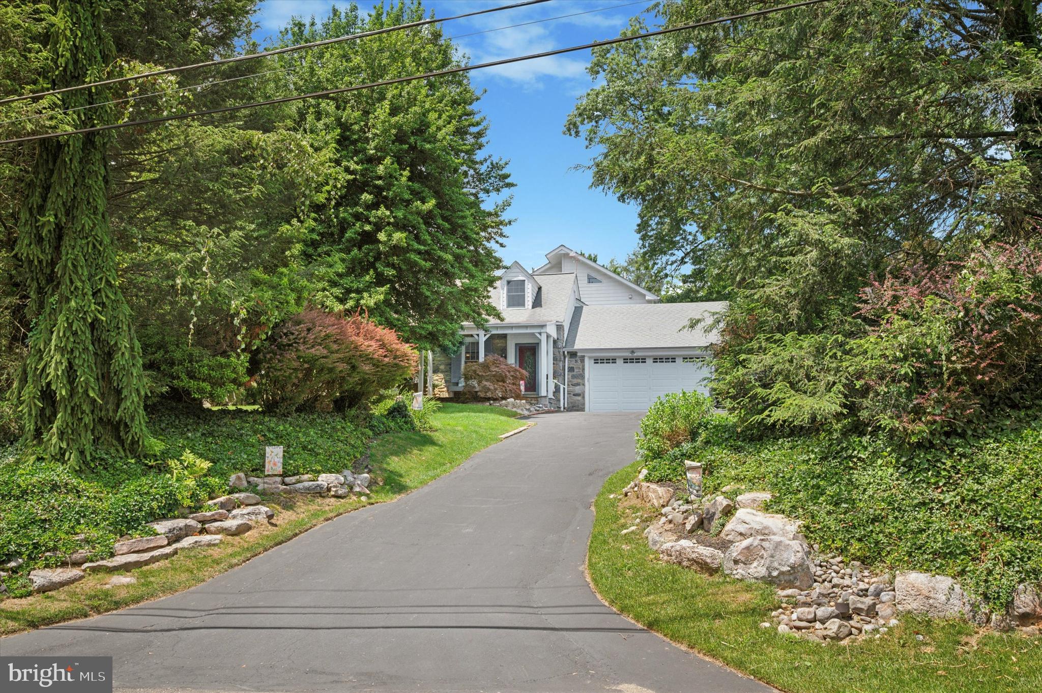 2440 Walton Road Huntingdon Valley, PA 19006 - Photo 2 of 47 a picture of a house with a yard and garden