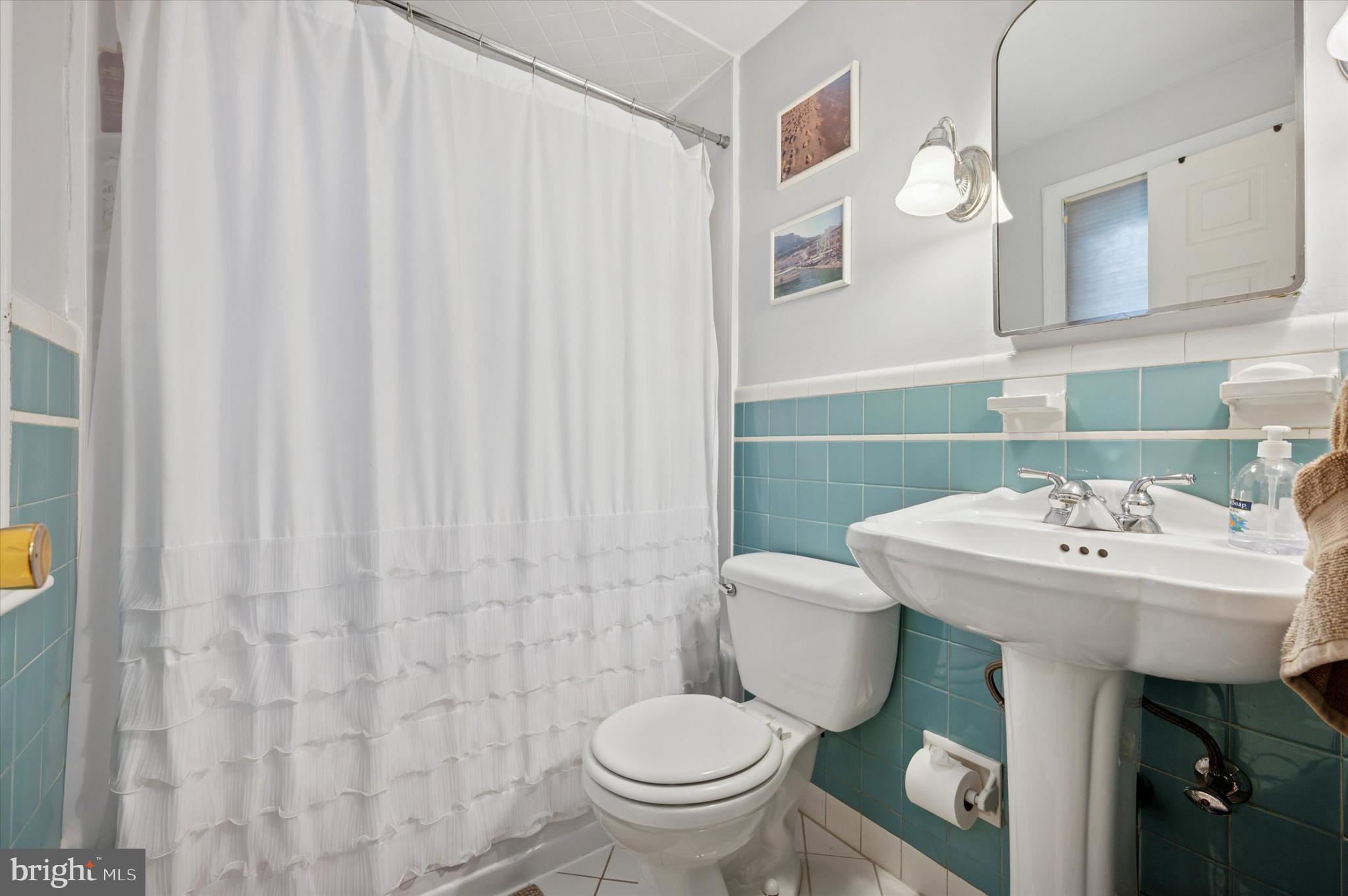 2440 Walton Road Huntingdon Valley, PA 19006 - Photo 21 of 47 a bathroom with a sink a toilet and a mirror