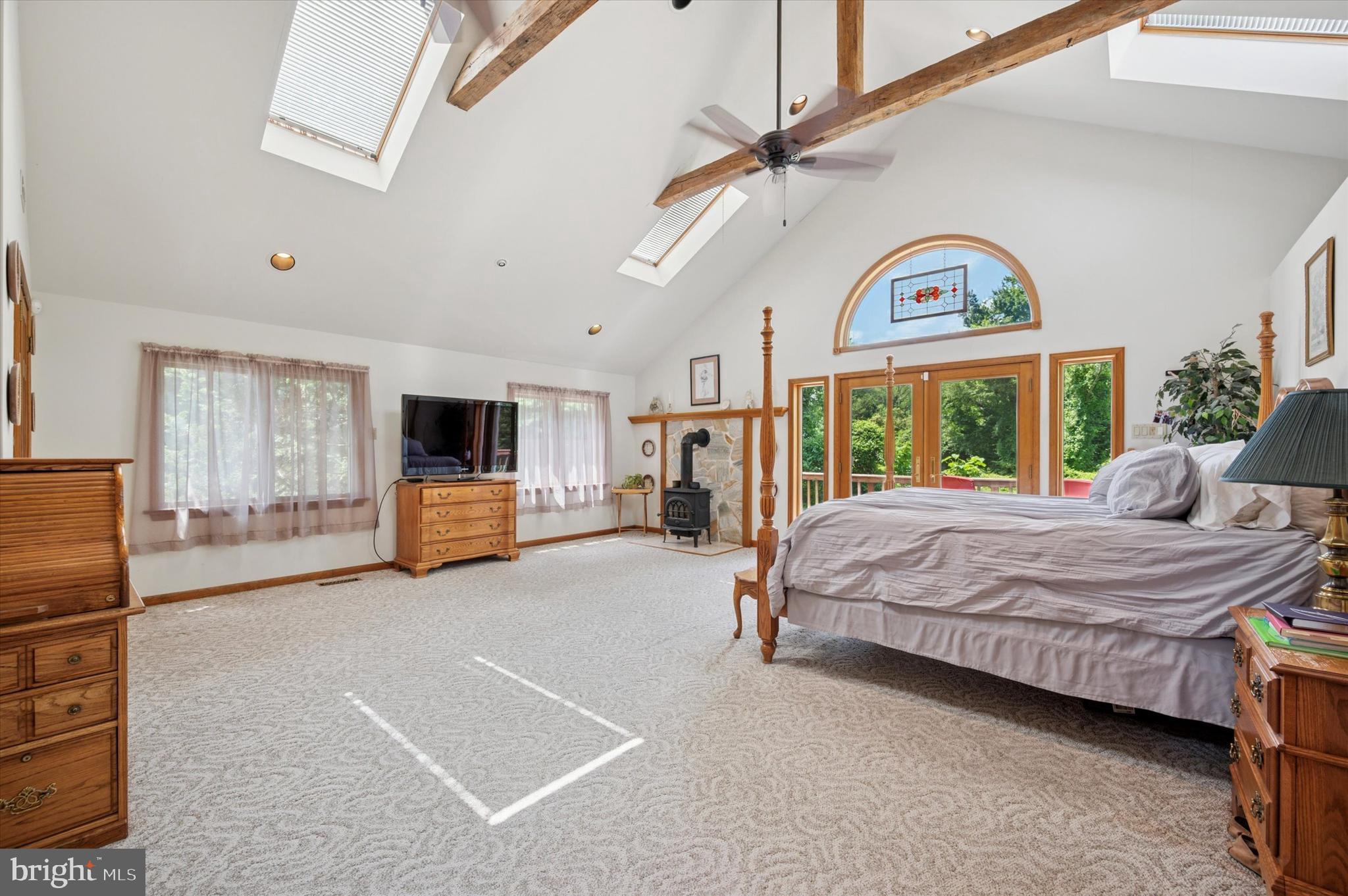 2440 Walton Road Huntingdon Valley, PA 19006 - Photo 25 of 47 a spacious bedroom with a bed a window and dresser