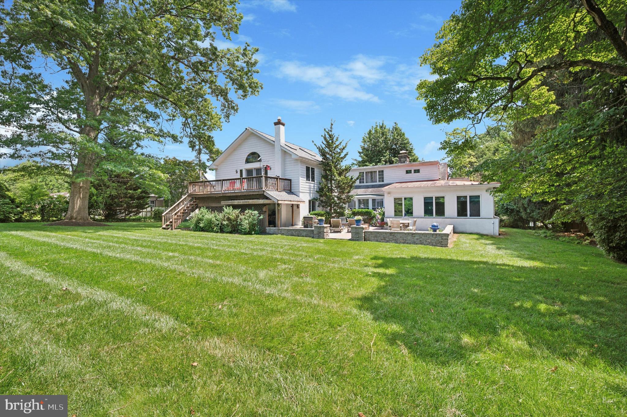 2440 Walton Road Huntingdon Valley, PA 19006 - Photo 36 of 47 a front view of a house with a garden