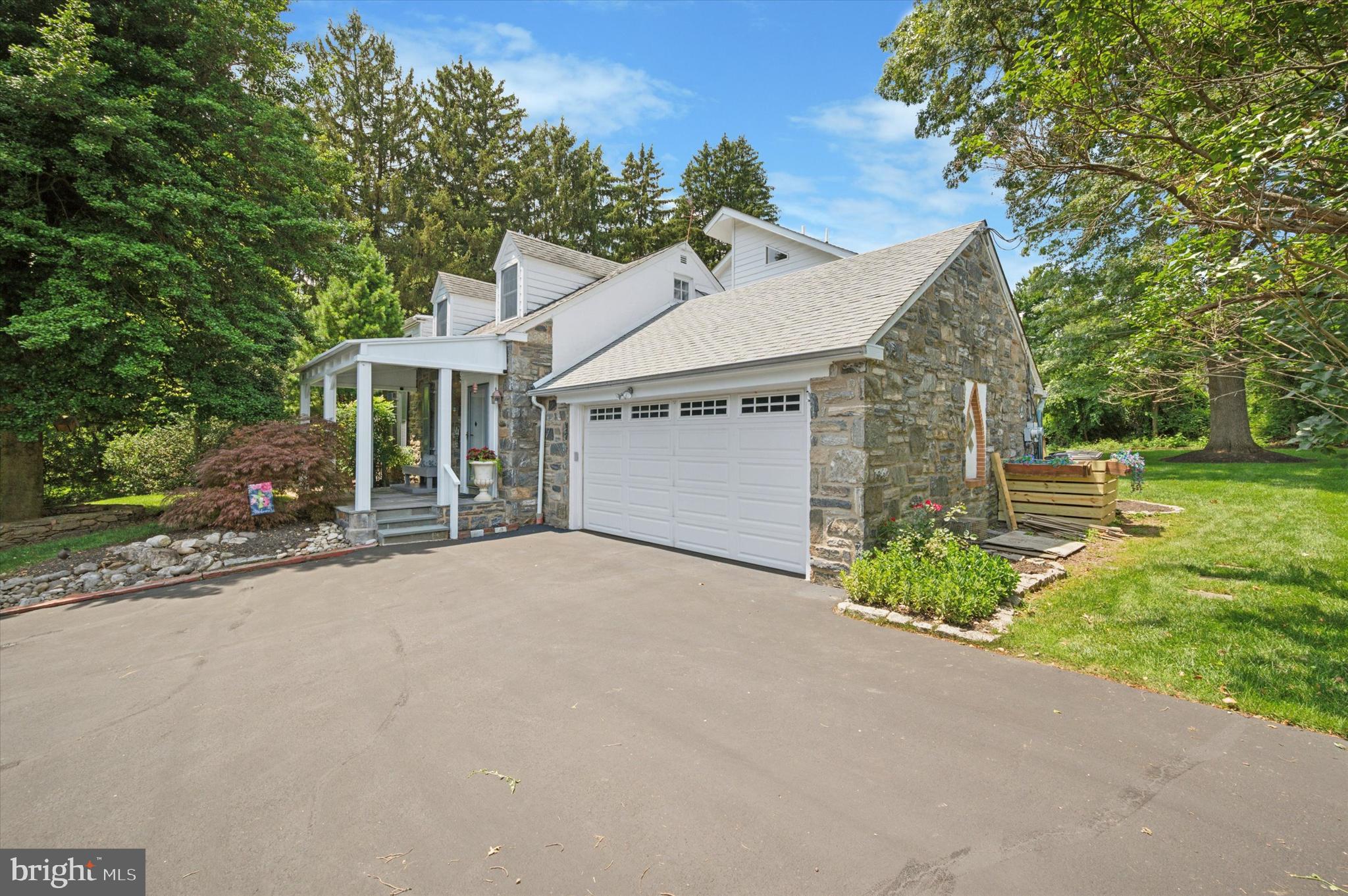 2440 Walton Road Huntingdon Valley, PA 19006 - Photo 4 of 47 front view of a house with a street