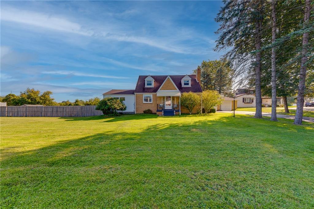 2676 Ridge Rd Extension Baden, PA 15005 - Photo 1 of 35 a front view of a house with a yard