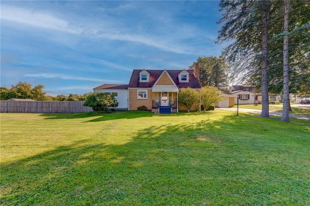 2676 Ridge Rd Extension Baden, PA 15005 - Photo 24 of 35 a front view of a house with garden and tree