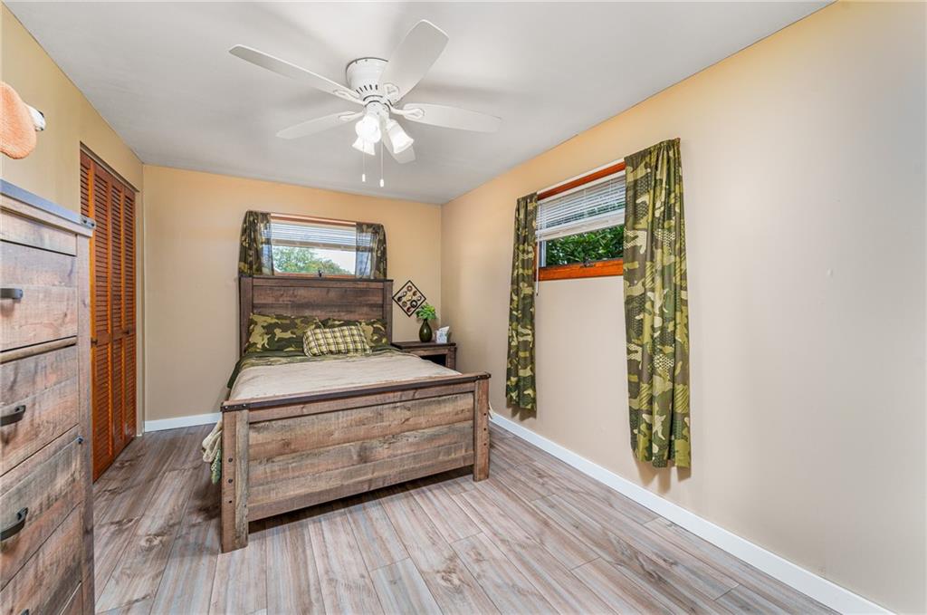 2676 Ridge Rd Extension Baden, PA 15005 - Photo 30 of 35 a room with a bed and a window