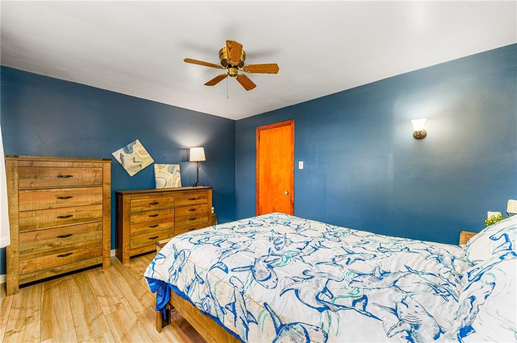 2676 Ridge Rd Extension Baden, PA 15005 - Photo 33 of 35 a bedroom with a bed and a dresser in it
