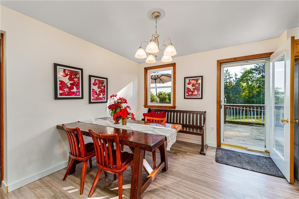 2676 Ridge Rd Extension Baden, PA 15005 - Photo 5 of 35 a view of a dining room with furniture wooden floor and a chandelier