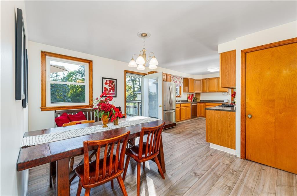 2676 Ridge Rd Extension Baden, PA 15005 - Photo 6 of 35 a view of a dining room with furniture window and wooden floor